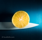 Half a lemon with knife