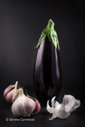 Aubergine with garlic and dark background